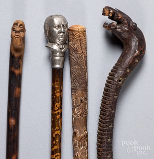 Four assorted canes/walking sticks