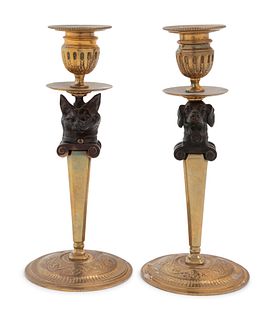 A Pair of Continental Gilt and Patinated Bronze Figural Candlesticks