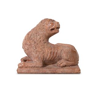 A Continental Carved Figure of a Recumbent Lion