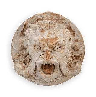 A Continental Carved Stone Grotesque Mask