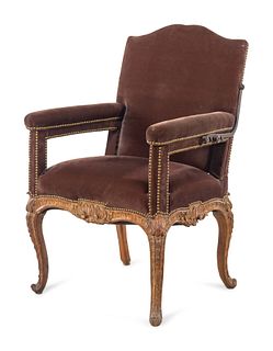 A Regence Velvet-Upholstered Carved Beechwood Reclining Armchair