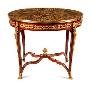 A Louis XV Style Gilt Bronze Mounted Parquetry Center Table with a Tiger's Eye Top
