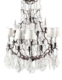 A French Patinated Metal and Cut Glass Eight-Light Chandelier