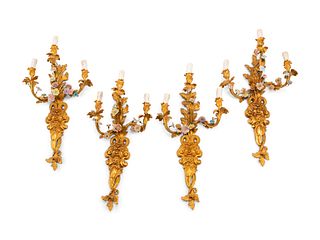A Set of Four French Gilt Bronze and Porcelain Three-Light Sconces