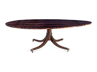 A Regency Style Macassar Ebony Oval Dining Table Top on an Associated Base