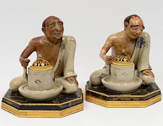 PAIR OF PARTIALLY GLAZED POTTERY FIGURES