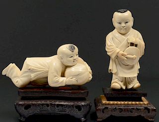 TWO CARVED IVORY FIGURES OF BOYS
