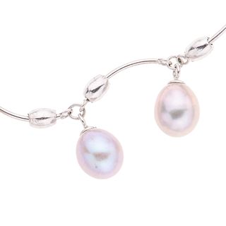 Collar con perlas en plata .925. 7 perlas cultivadas color gris. Peso: 8.7 g.