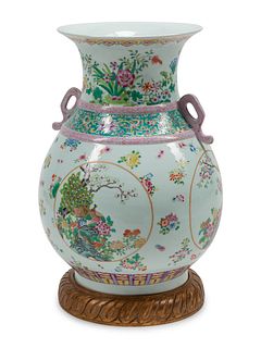 A Chinese Export Style Porcelain Vase on a Carved Giltwood Base