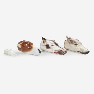 A group of four English greyhound-form porcelain or pearlware stirrup cups Staffordshire, and others, 19th century