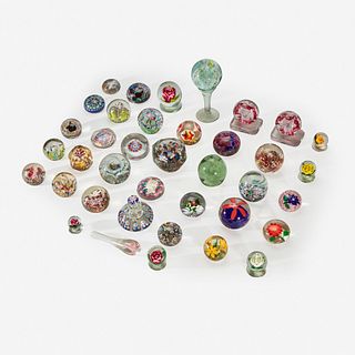 A collection of assorted glass paperweights Millville, New Jersey, Cambridge, Ohio, Sandwich, Massachusetts,  England and France 19th and 20th century