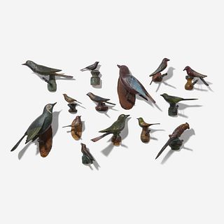 A group of fourteen carved and painted birds