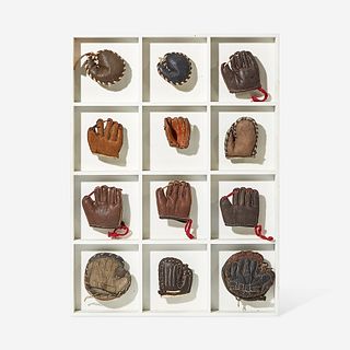 A collection of twelve miniature leather baseball gloves first half 20th century