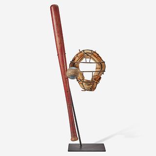 A baseball assemblage: red stained softball bat, catcher's mask and practice ball circa 1940