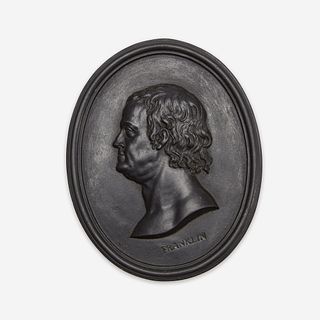 A Wedgwood & Bentley black basalt portrait medallion of Benjamin Franklin (1706-1790) Modeling attributed to William Hackwood, Etruria, Staffordshire,