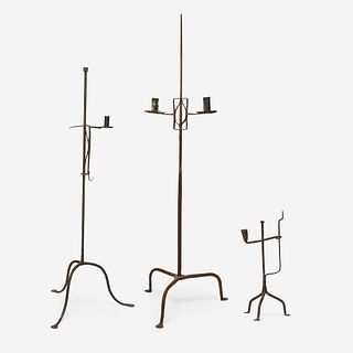 A group of three wrought iron candle stands 18th/19th century