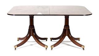 A Sheraton Style Mahogany Dining Table Height 28 1/2 x depth 47 1/2 inches