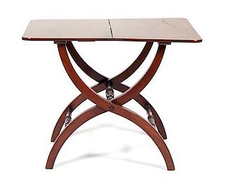An English Mahogany Folding Utility Table Height 28 1/4 x width 35 1/2 x depth 26 inches.