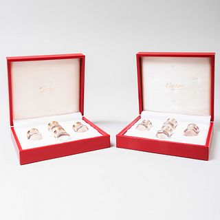 Two Sets of Four Cartier Silver Casters