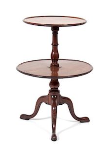 A Round Two-tiered Table Height 34 1/4 x diameter 23 1/2 inches.