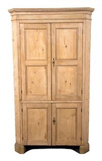 An Irish Pine Corner Cabinet Height 86 x width 48 x depth 28 inches.