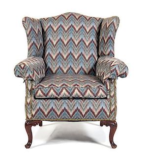 An American Wingback Armchair Height 38 x width 30 1/2 x depth 30 inches.