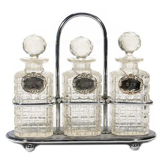 A Victorian Style Cut Glass Suite of Liquor Bottles