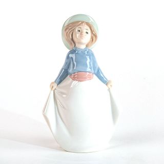 Girl Picking Up Her Skirt 02001290 - Nao Porcelain Figure by Lladro