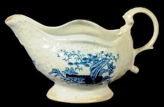 A LIVERPOOL STRAP FLUTED CREAM BOAT, PHILIP CHRISTIAN, C1765-70  painted in underglaze blue with