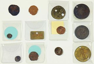 TWELVE COPPER, BRONZE OR BRASS ROMAN AND OTHER ANCIENT COINS, 19TH CENTURY TRADE TOKENS AND PIT