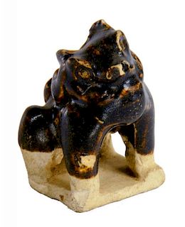 A CHINESE PORCELANEOUS MINIATURE MODEL OF A DOG OF FO, SONG DYNASTY  the upper part in brown