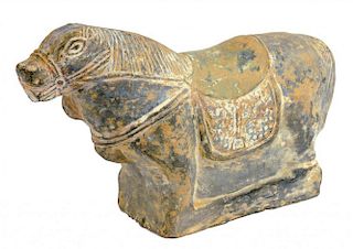 A CHINESE EARTHENWARE MODEL OF A CAPARISONED HORSE, YUAN DYNASTY  of grey fabric with traces of