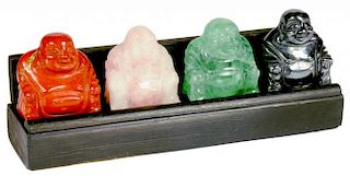 A SET OF FOUR CHINESE HARDSTONE CARVINGS OF HOTEI, LATE 20TH C  of rose quartz, fluorite, hematite