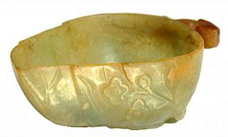 A CHINESE JADE BRUSH WASHER IN THE FORM OF A LEAF, 19TH C  the russet coloured stalk forming the