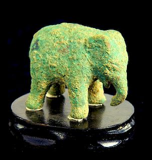A CHINESE BRONZE MINIATURE MODEL OF AN ELEPHANT, HAN DYNASTY  uneven green patina, 4cm l (ex David