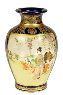 A JAPANESE SATSUMA WARE BLUE GROUND EARTHENWARE VASE, MEIJI  enamelled to either side with groups of