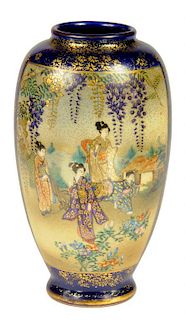 A JAPANESE SATSUMA WARE BLUE GROUND VASE, MEIJI  enamelled to either side with garden scenes and