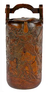 A JAPANESE CARVED BAMBOO FLASK, MEIJI  a scene to the front, the reverse with Tanuki the mythical
