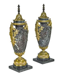 A PAIR OF FRENCH GILT BRONZE MOUNTED MARBLE URNS