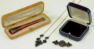 A GOLD MOUNTED AMBER CIGARETTE HOLDER, CIRCA 1930, CASED AND A LATE 19TH CENTURY GARNET NECKLACE AND