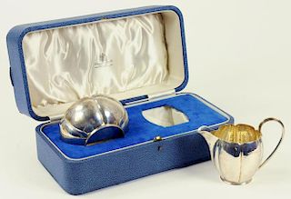 A GEORGE V SILVER MELON SHAPED CREAM JUG AND SUGAR BOWL INITIALLED S, LONDON 1934, CASED 7OZS