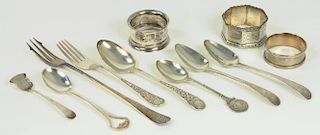 THREE SILVER NAPKIN RINGS, VARIOUS MAKERS AND DATES, A SILVER MAN IN THE MOON CHILD'S SPOON, AN