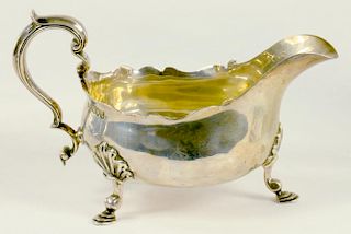 A VICTORIAN SILVER SAUCE BOAT, ON THREE FEET, LONDON 1897, 7OZS