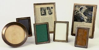 ONE CIRCULAR AND SIX RECTANGULAR SILVER PHOTOGRAPH FRAMES, ENGINE TURNED, VARIOUS MAKERS AND DATES