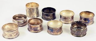 NINE SILVER NAPKIN RINGS, VARIOUS MAKERS AND DATES, 4OZS