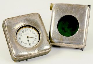 TWO SILVER MOUNTED LEATHER TRAVELLING CLOCK CASES, ONE CONTAINING A BRASS 'MAMMOTH' WATCH WITH