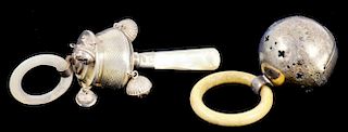 A GEORGE V SILVER BABY'S RATTLE WITH MOTHER OF PEARL HANDLE AND RING, BIRMINGHAM 1915 AND ANOTHER