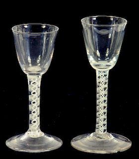 TWO SIMILAR OPAQUE TWIST STEM WINE GLASSES WITH ROUNDED FUNNEL BOWL AND CONICAL FOOT, C1770