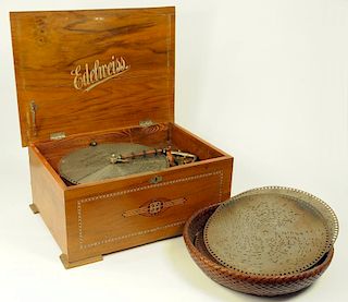 AN EDELWEISS WALNUT DISC MUSICAL BOX, THE IRON MECHANISM WITH ANCHOR TRADEMARK, THE CASE WITH