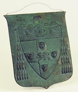 A VICTORIAN EMBOSSED COPPER SHIELD OF ARMS